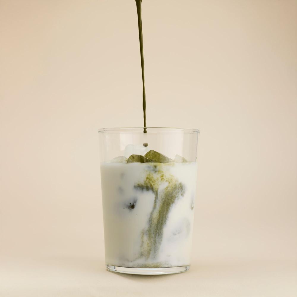 DailyBasis mixed with milk being poured into a glass.